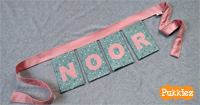 Handgemaakte naamslinger Noor